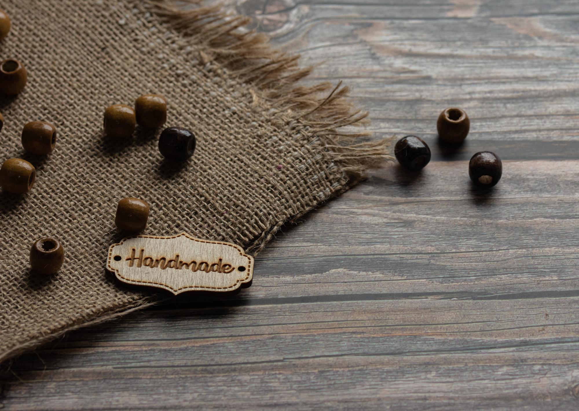 Pair of embroidered patches on kraft table